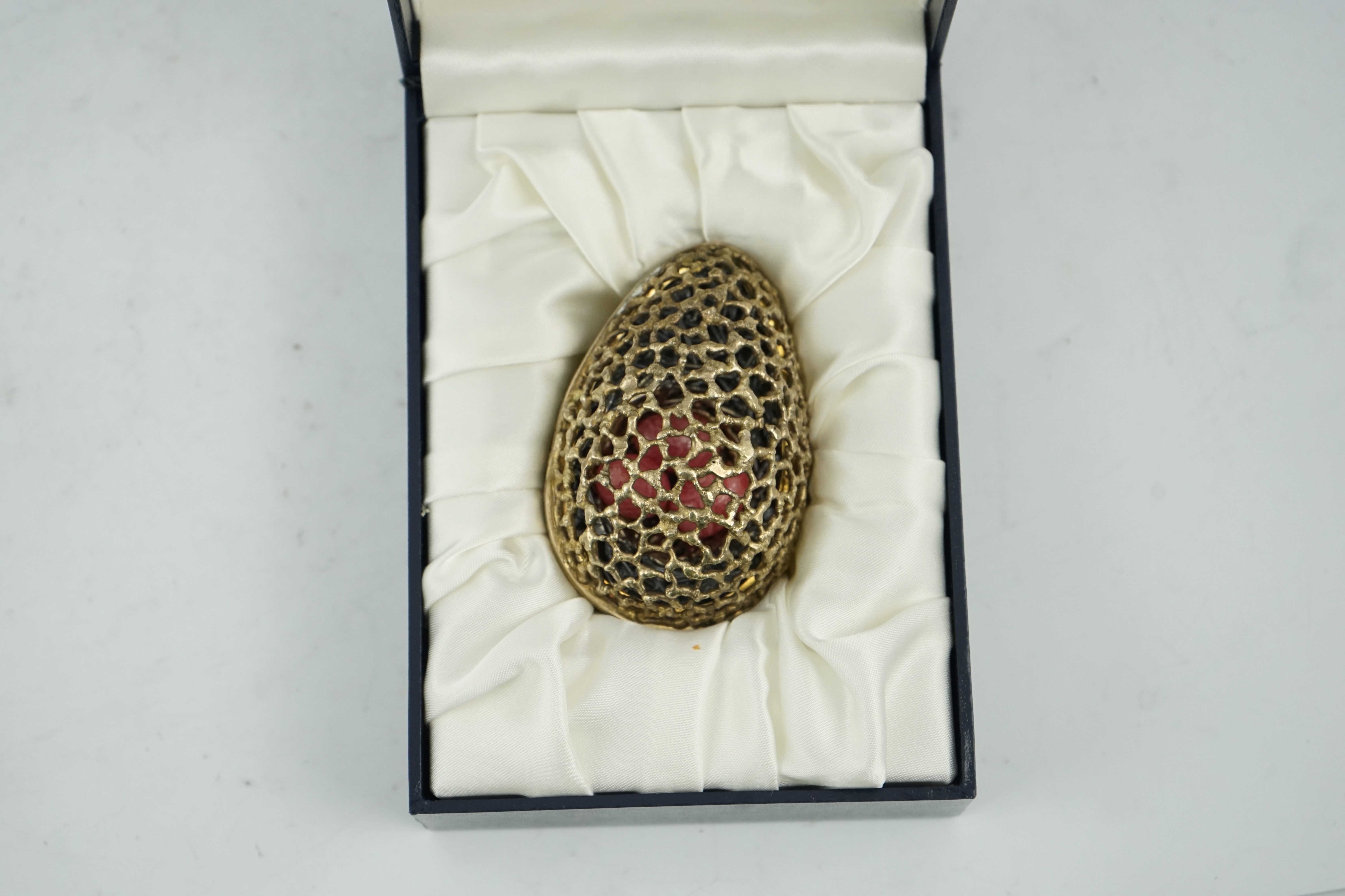 An Elizabeth II pierced silver gilt surprise egg by Stuart Devlin